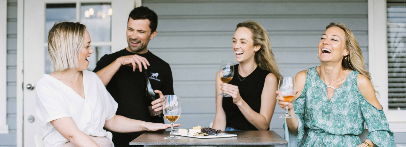 People enjoying wine and cheese at Gundog Estate